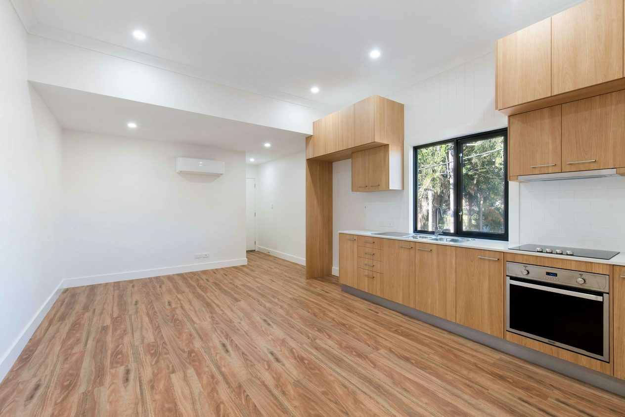 Empty open-plan kitchen diner, before staging